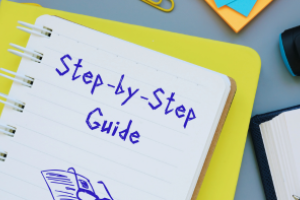 kladblok met daarop geschreven: Step by Step Guide